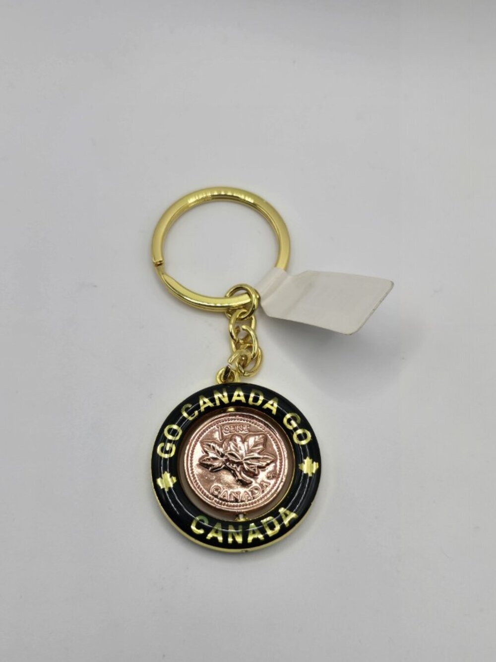 Go Canada Go, Canadian Lucky Penny, Keychain, Black Enamel Circle Frame. Spinner